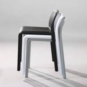 Black plastic chairs stacked